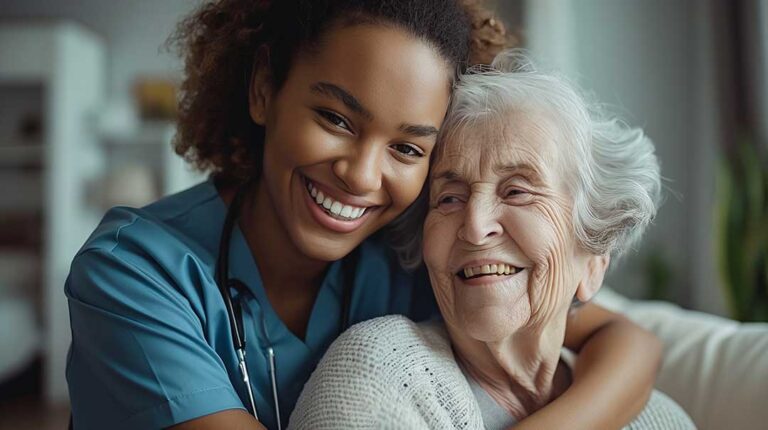 Care staff review a staffing schedule while assisting an older resident in a bright common room.